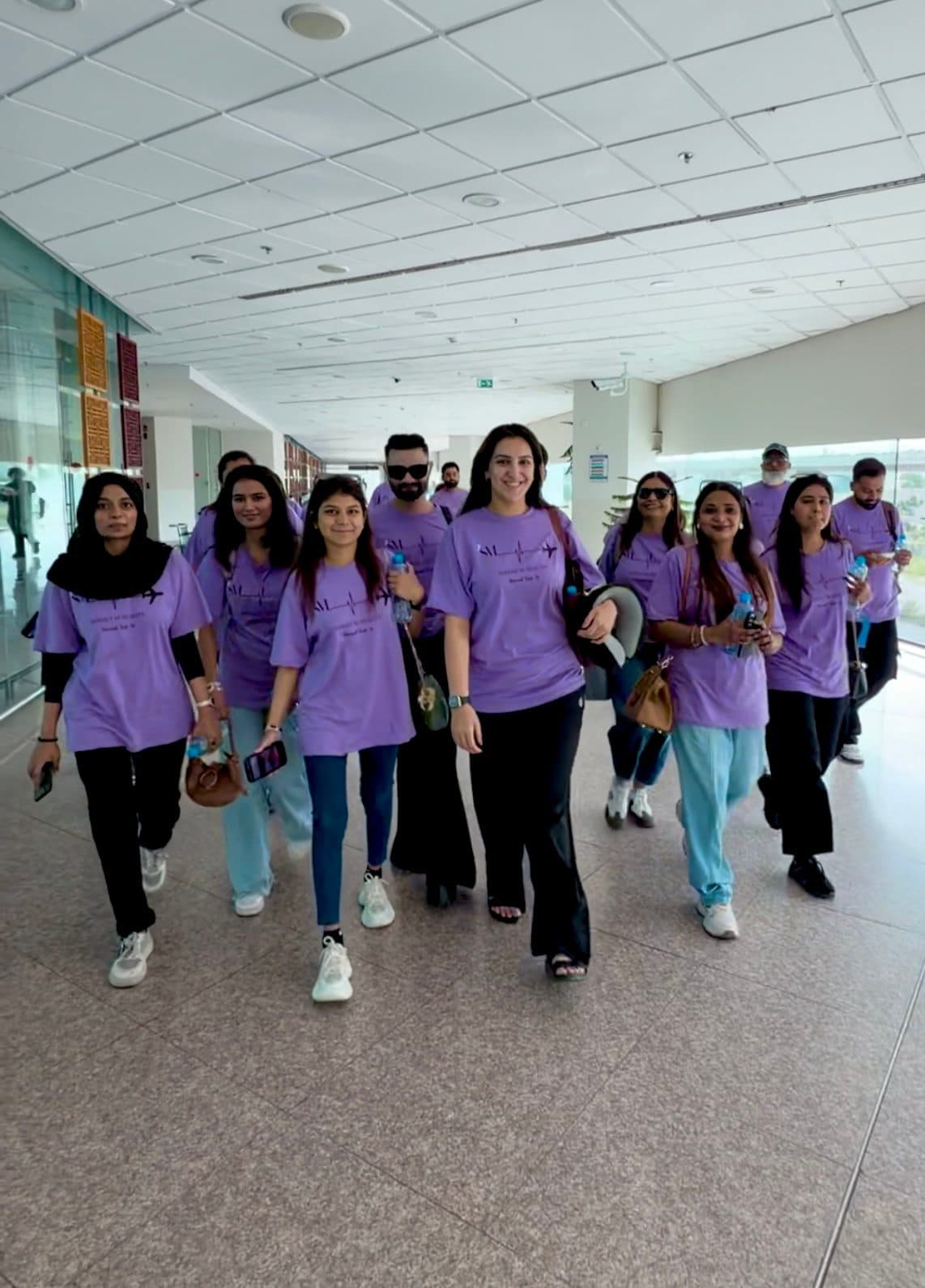 Samah M Beauty team at the airport in matching lavender shirts